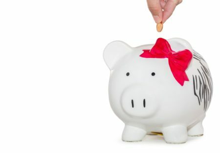 a hand holding a white bunny