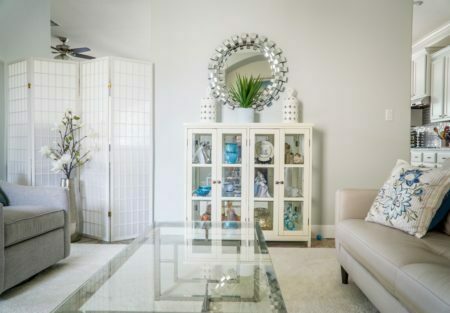 a living room with a glass wall