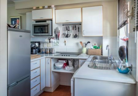 a kitchen with white cabinets