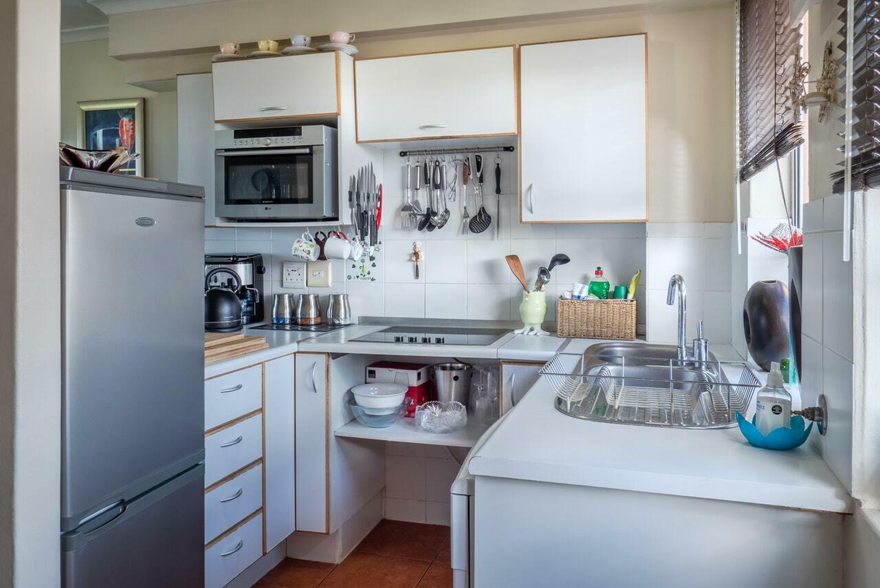 a kitchen with white cabinets