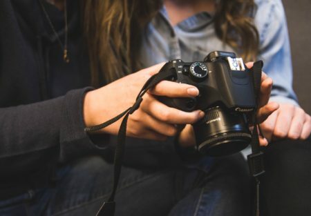 a person holding a camera