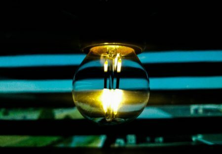 a flame in a dark room