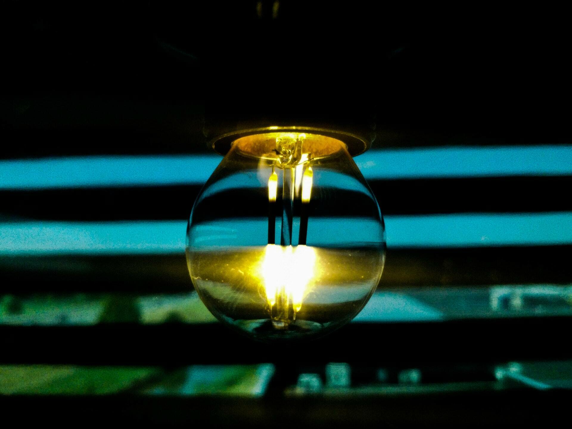 a flame in a dark room