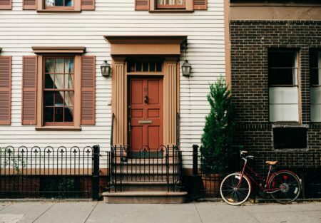 a bicycle parked in front of a house