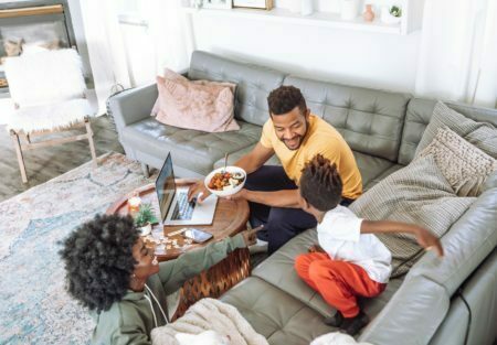 a family eating in the living room