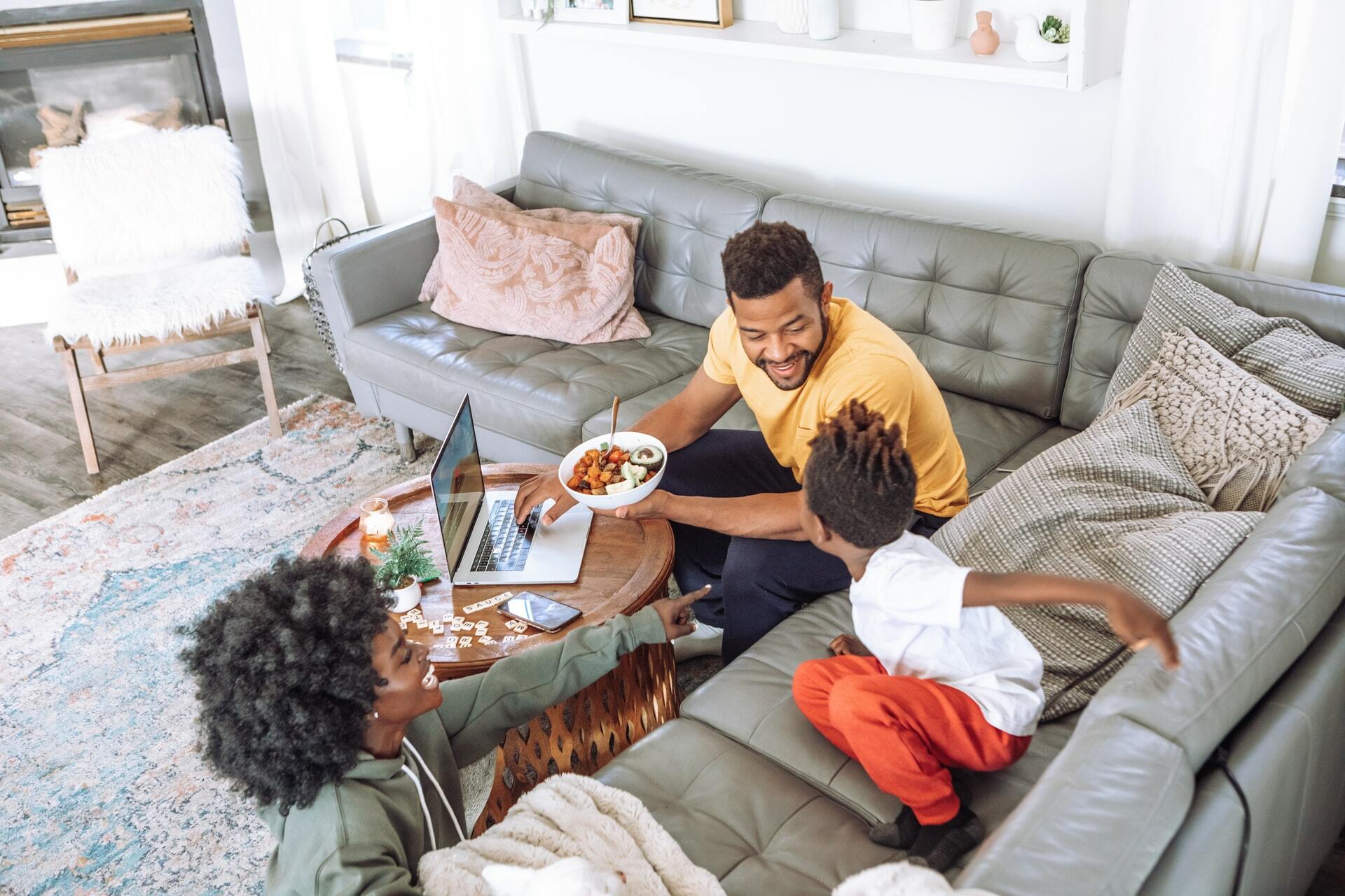 a family eating in the living room