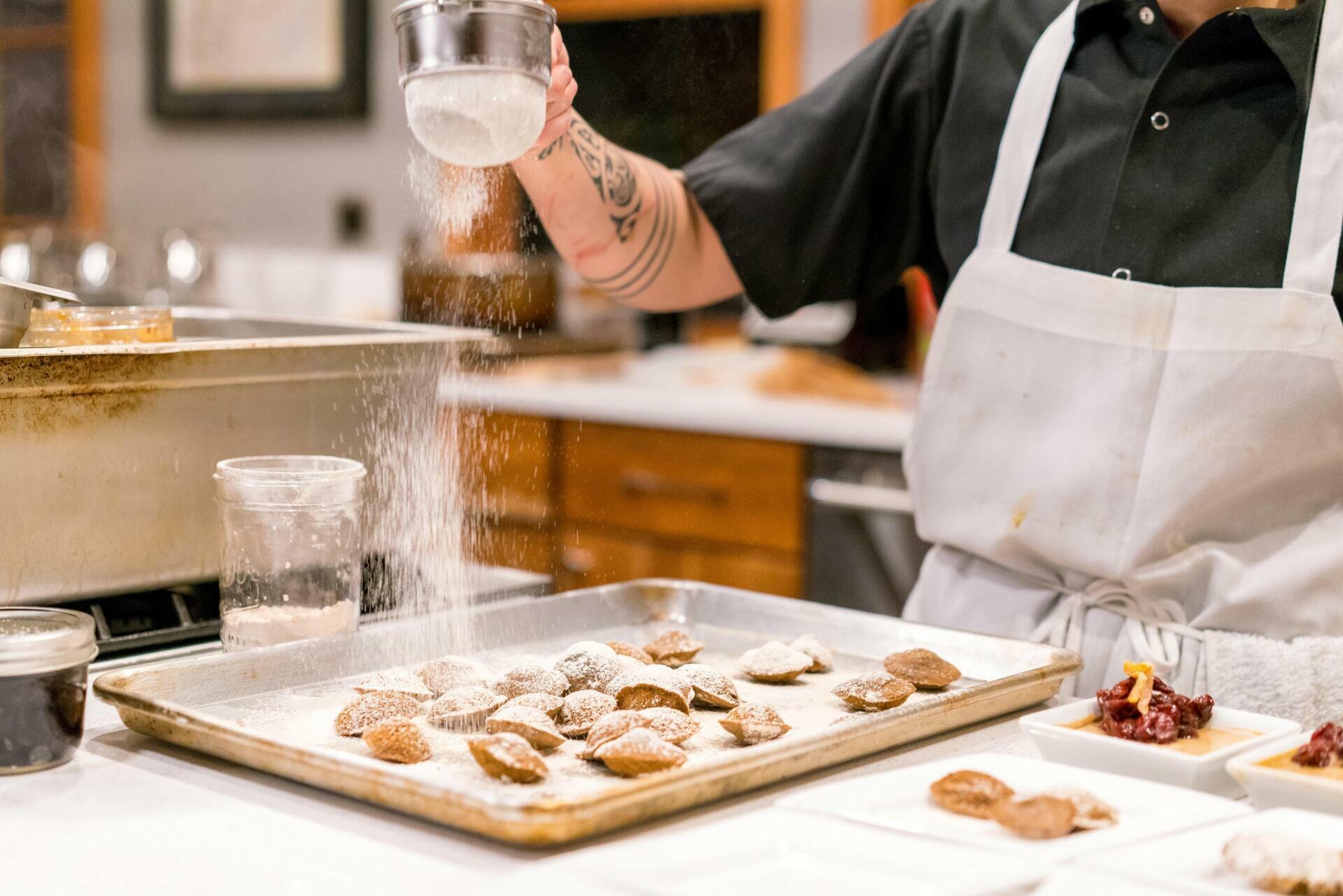 a chef preparing cookies in a kitchen