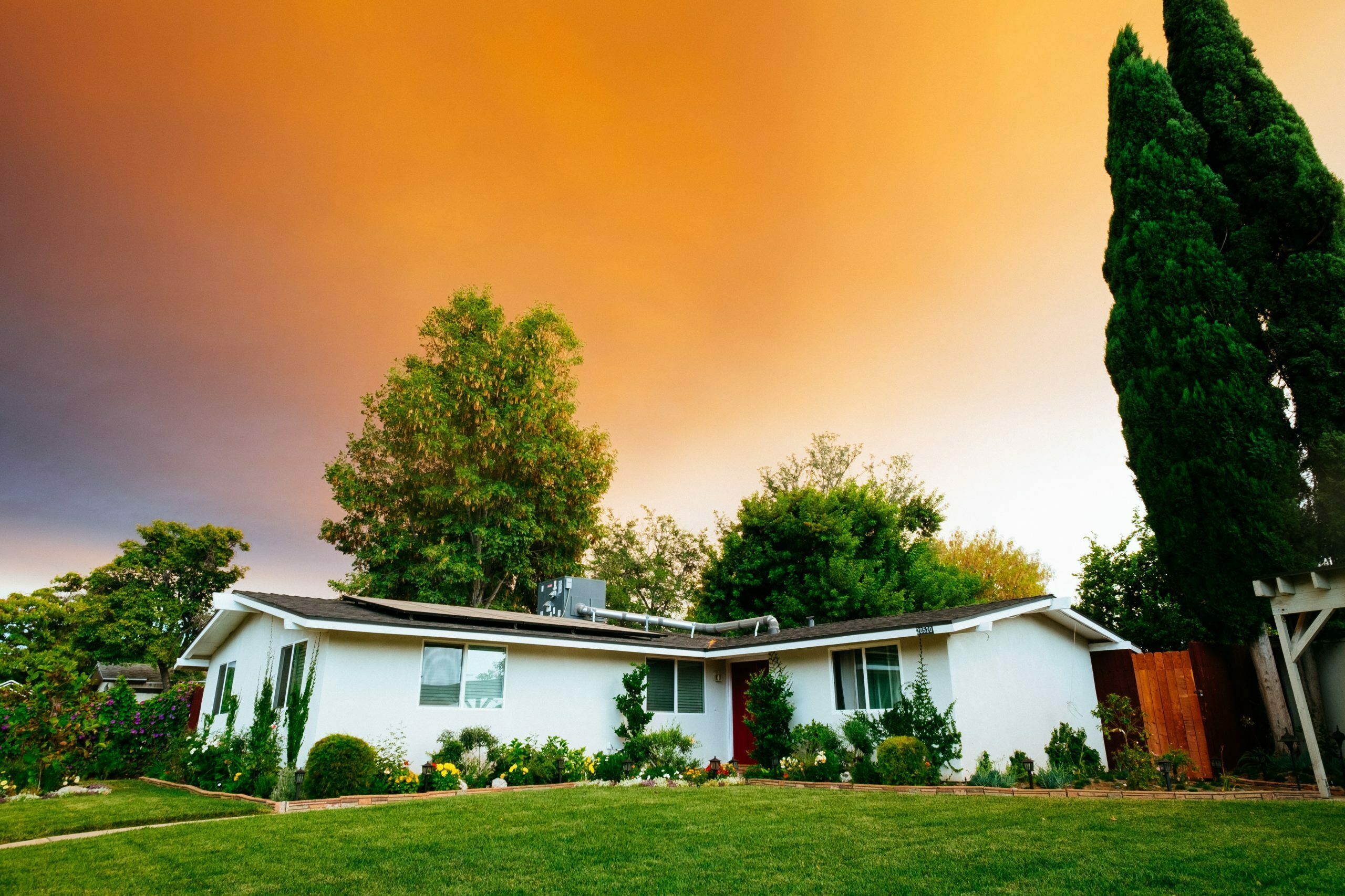 a house with trees and grass