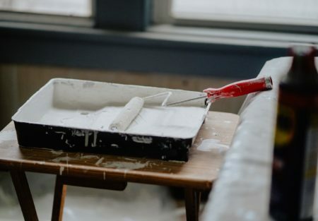 a box with a red ribbon on a table