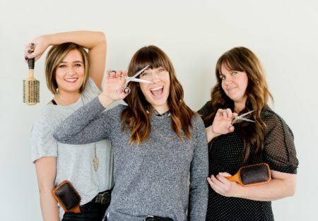 a group of women holding up their glasses
