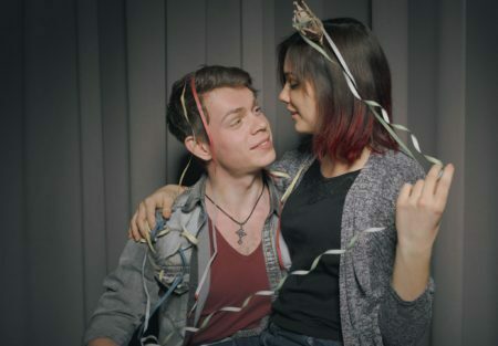 Happy couple in a photo booth