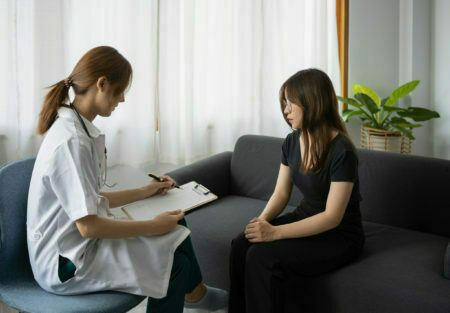 Female psychologist giving advice to patient. Mental health and psychotherapy concept.
