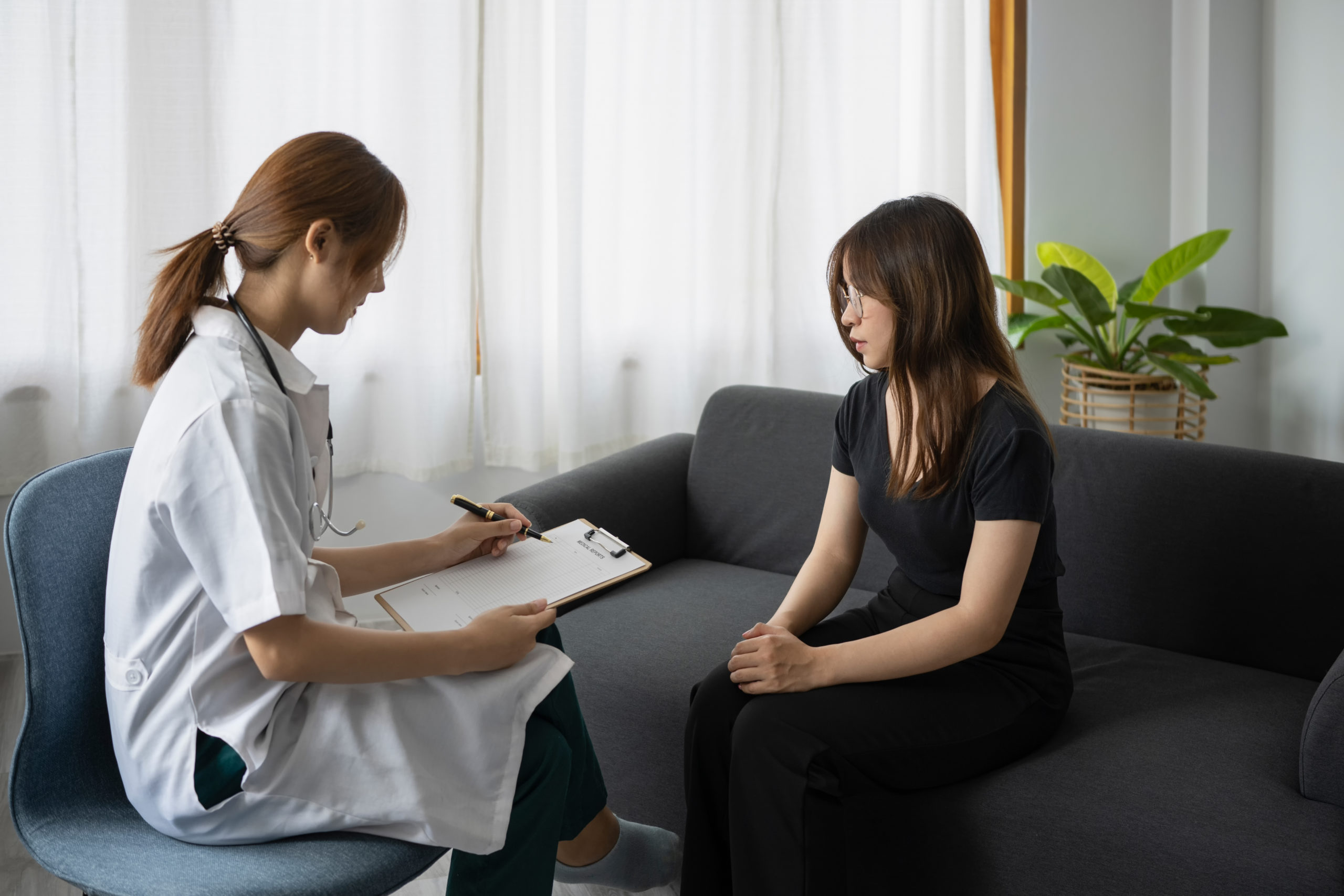 Female psychologist giving advice to patient. Mental health and psychotherapy concept.
